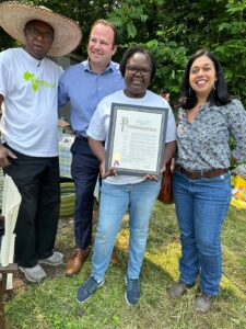 Montgomery County Council Members Andrew Friedsen and Natali Fani-Gonzalez present the Montgomery County Council Proclamation of May 25th 2023 to Afrithrive Co-Founders Dr. Truphen Choit and Prof. Charles Choti during a ceremony held at the Afrithrive Cultural Farm in Poolesville on Wednesday, June 7th 2023.